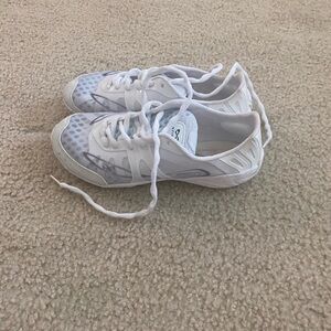 NFINITY white cheer shoes.